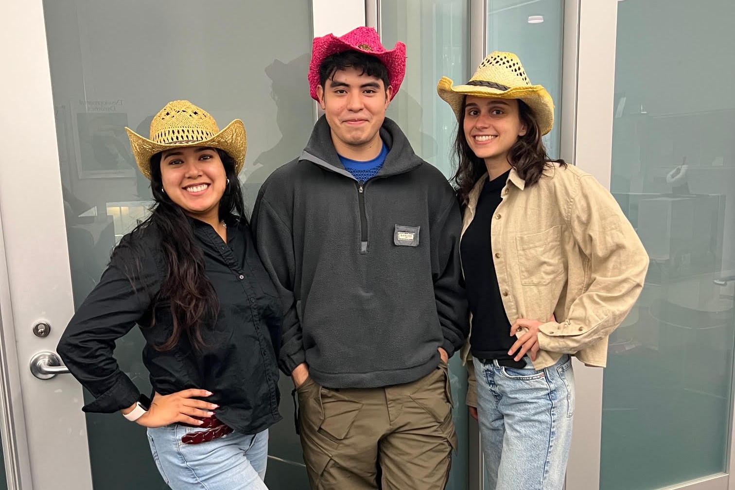 Posing with cowboy hats for Halloween